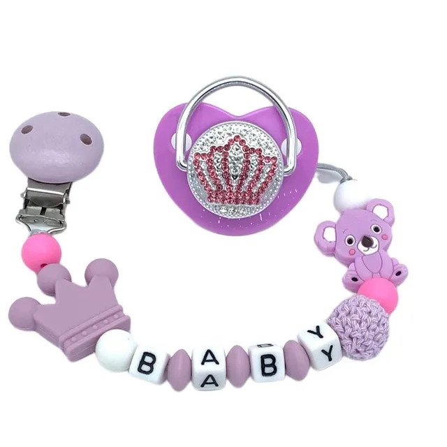 Luxury baby pacifier with initial in gold colour with Muxika pin