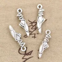 Set of 20 pendants in the shape of ballet slippers in bronze and silver colours for making your own jewelry